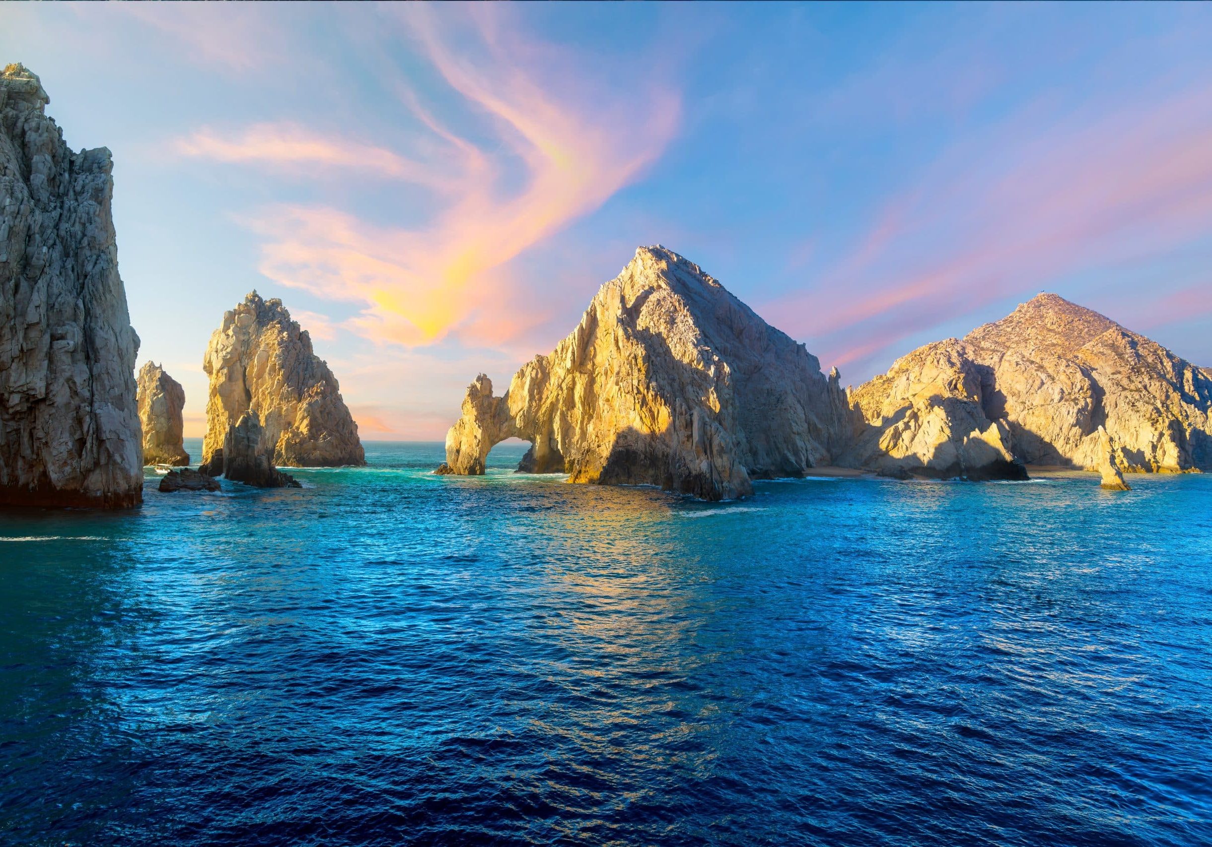 TheElArcoArchBathedInColorfulLightAtSunset